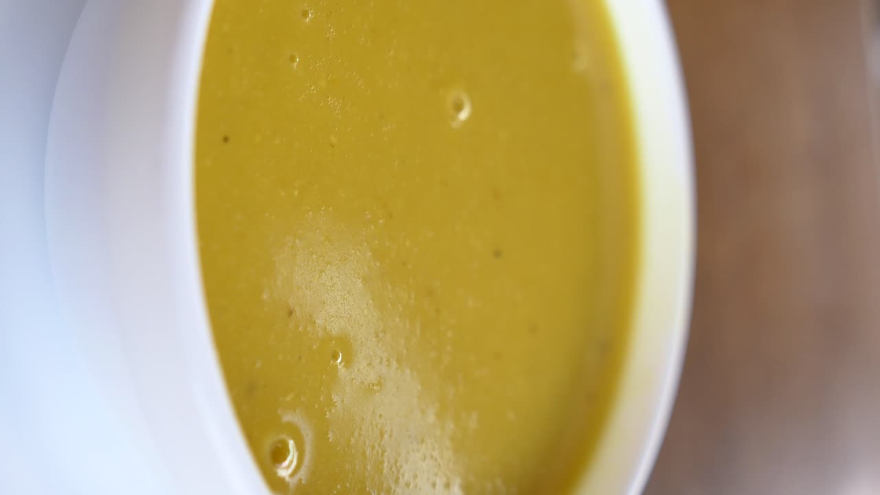 Yellow Soup in a Bowl