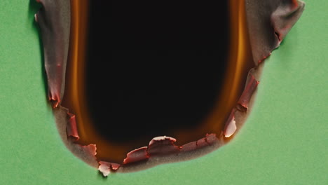 burnt paper with hole