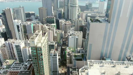 central hong kong, top down aerial view of traffic and city skyscrapers