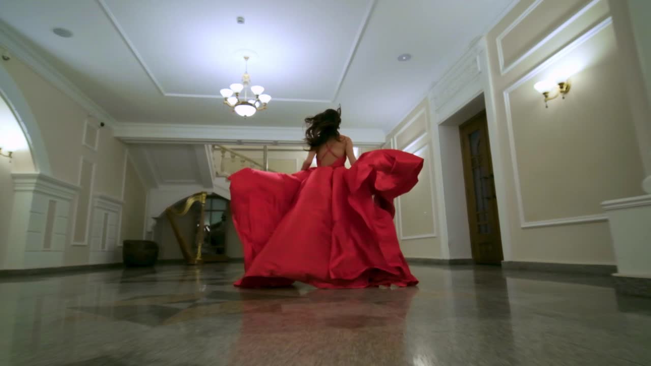 A Captivating Journey in a Flowing Red Gown Through an Elegant Hallway, Showcasing Beauty and Grace in Motion