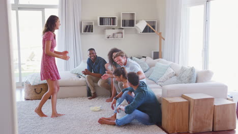 Group-Of-Friends-At-Home-Having-Fun-Playing-Charades-Together