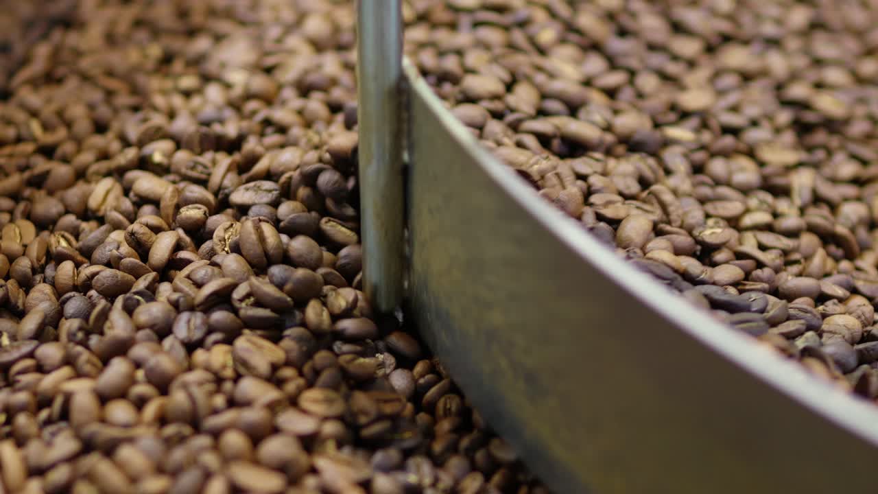 Explore the intricate journey of coffee beans from raw roast to aromatic delight in this engaging tour.