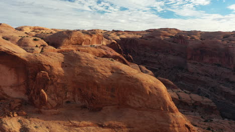 Drone-shot-of-the-grand-canyon-in-the-united-states-with-its-orange-and-arid-mountains---aerial-view