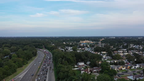 an high angle view next to a busy parkway in the evening, during rush hour