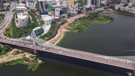 Drone-footage-of-the-Durgam-Cheruvu-Cable-Bridge-in-Hyderabad,-India,-which-spans-the-lake-and-connects-Jubilee-Hills-and-Madhapur