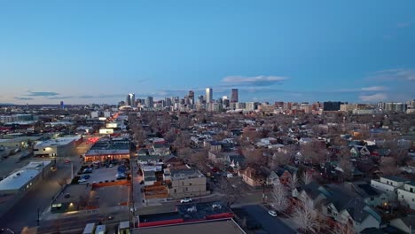 panoramic aerial pullback above denver colorado suburb at blue hour dusk