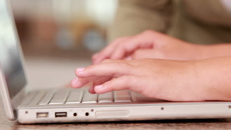 Mother-and-daughter-using-laptop-together