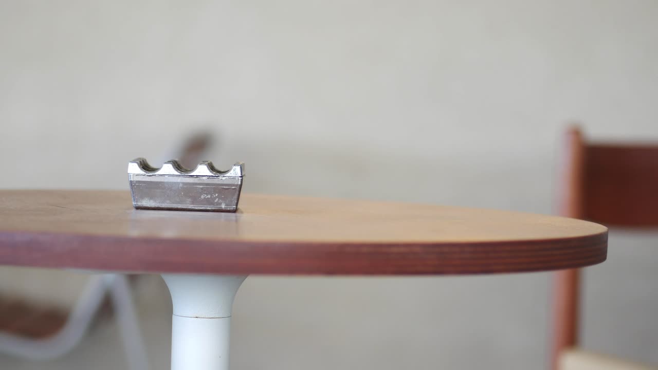 An ashtray on a wooden table
