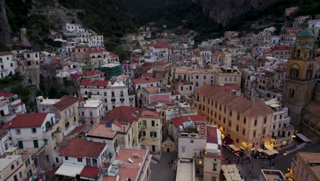 Cinematic-Aerial-Flight-over-City-Lights-of-Amalfi-on-Italy-Coast
