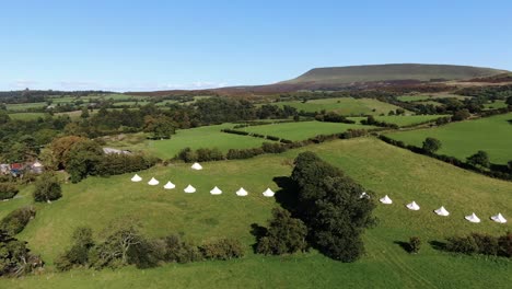 aerial filming of luxury bell tents in welsh countryside-3