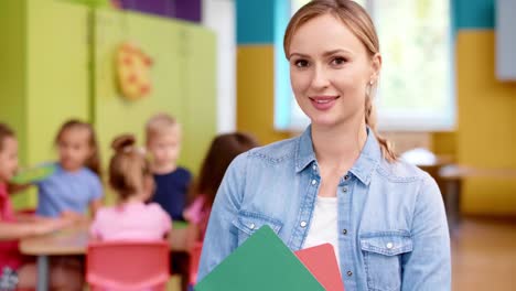 smiling female teacher in the preschool