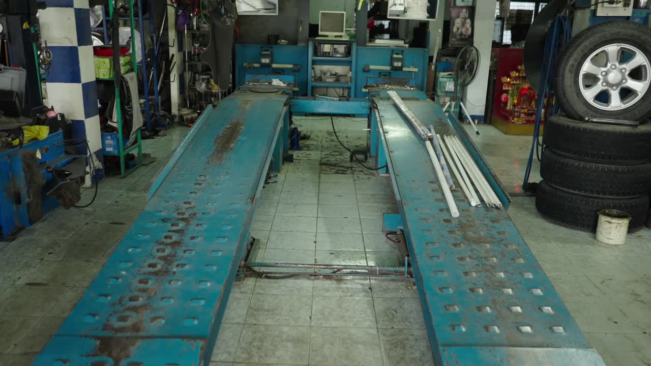 Empty Car Repair Shop with Lift and Equipment
