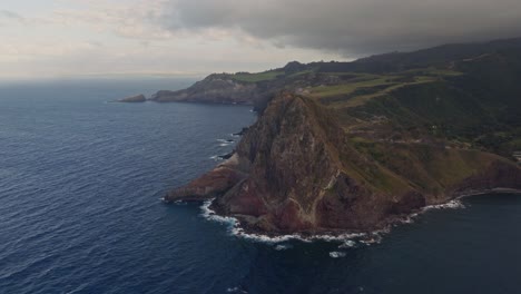 dramatic coastal view of volcanic island