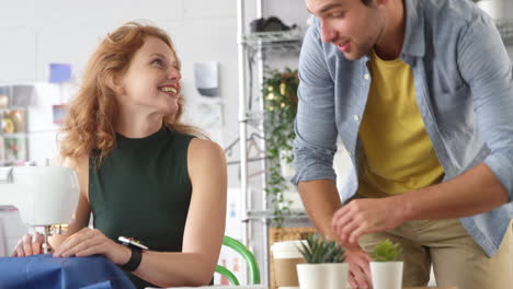 Male-And-Female-Students-Or-Business-Owners-Working-In-Fashion-Having-Meeting-In-Studio