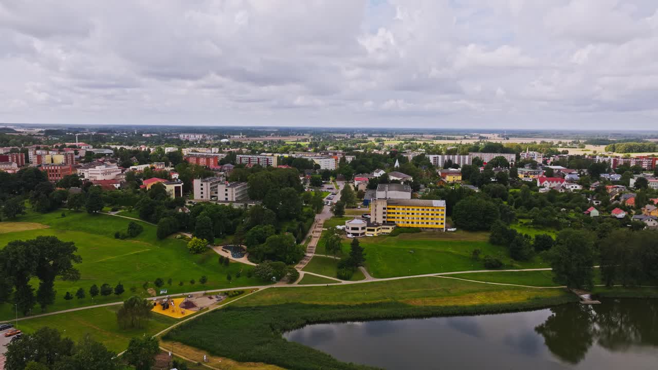Cinematic establishing aerial shot of Talsi town and surrounding nature