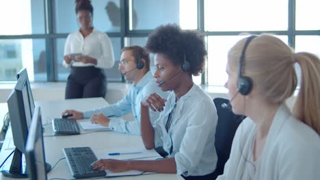 female african american mentor and call center operators