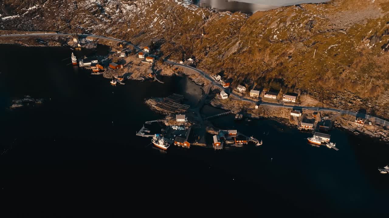 Reine, Lofoten Islands, Nordland, Norway - A Quiet Fishing Village Nestled Between Rugged Hills and the Sea - Aerial Descend Shot