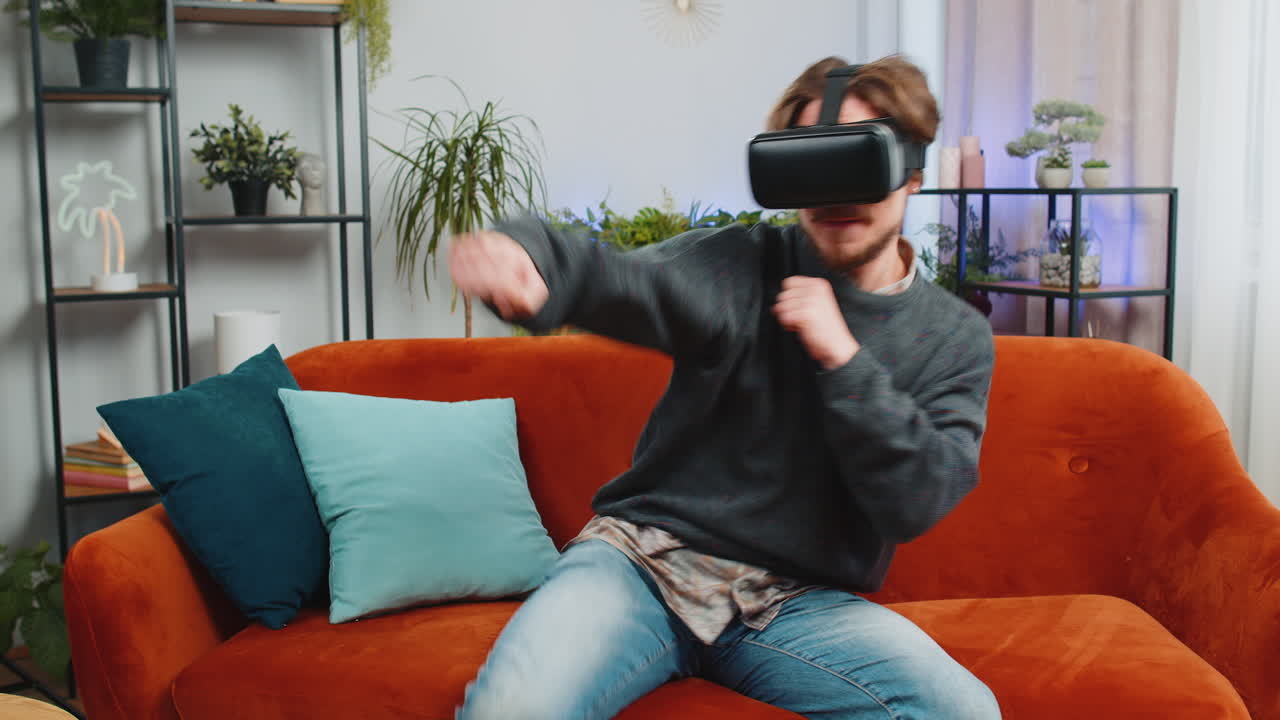 Bearded man use virtual reality futuristic technology headset play simulation 3d video game at home