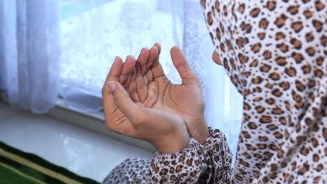 close up of muslim women hand praying.