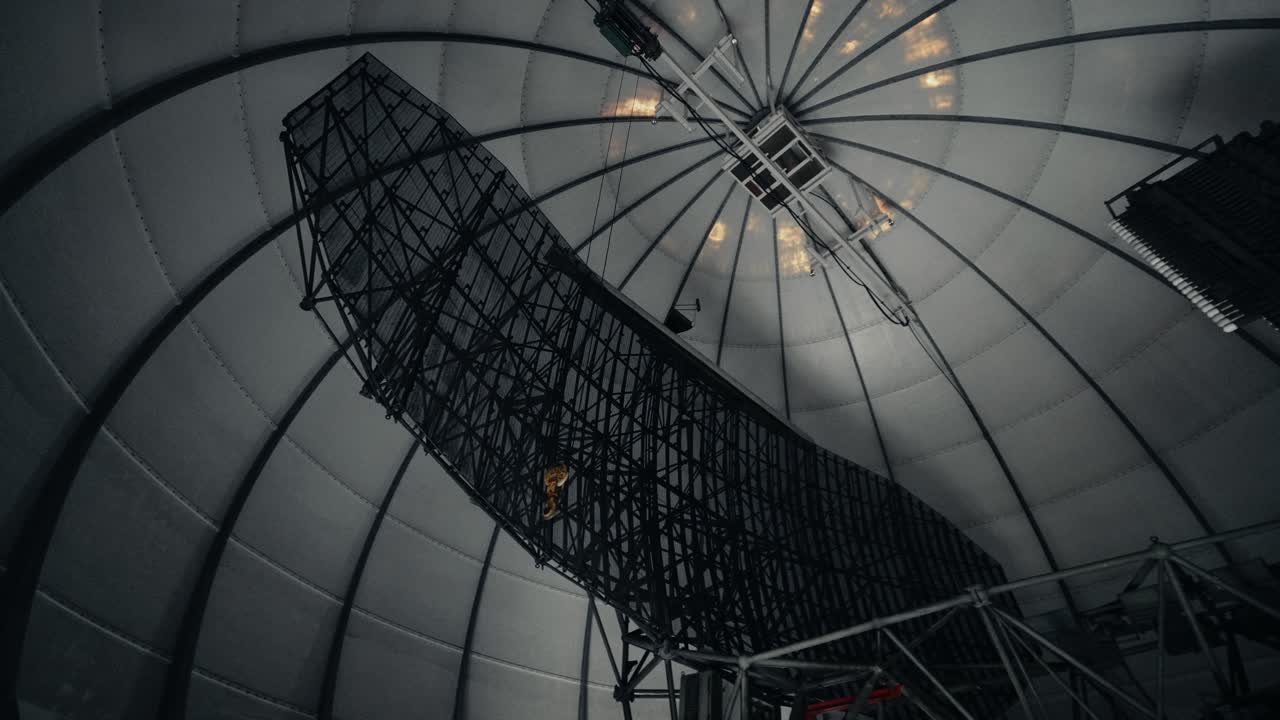 Massive Radar Antenna Rotating Inside a Scientific Dome