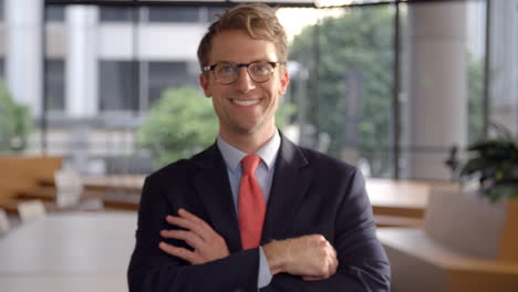 Young-white-businessman-walking-into-focal-plane