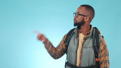 Hiking,-pointing-and-black-man-on-blue-background