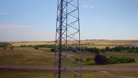 drone view of a cellular tower with meadows in the background