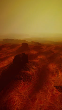 vast desert landscape with sand dunes sparse vegetation and a clear blue sky