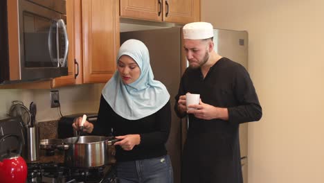 middle eastern young couple make soup she stirs track right