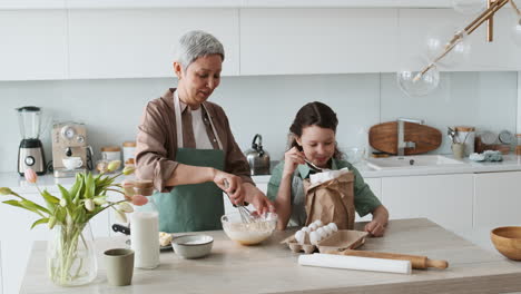 grandma and girl baking