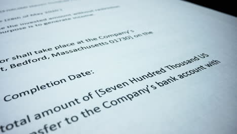 business documents lying on table. business man hand checking terms of contract