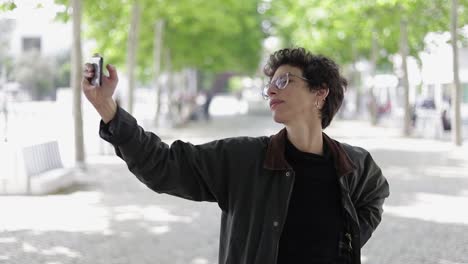 Woman-taking-selfie-with-smartphone-outdoor