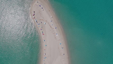 aerial view of crowded sandbar in turquoise water