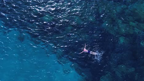 refreshing swim at coral reef waters of cala coticcio caprera sardinia