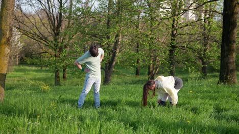 couple dancing and stretching in a park