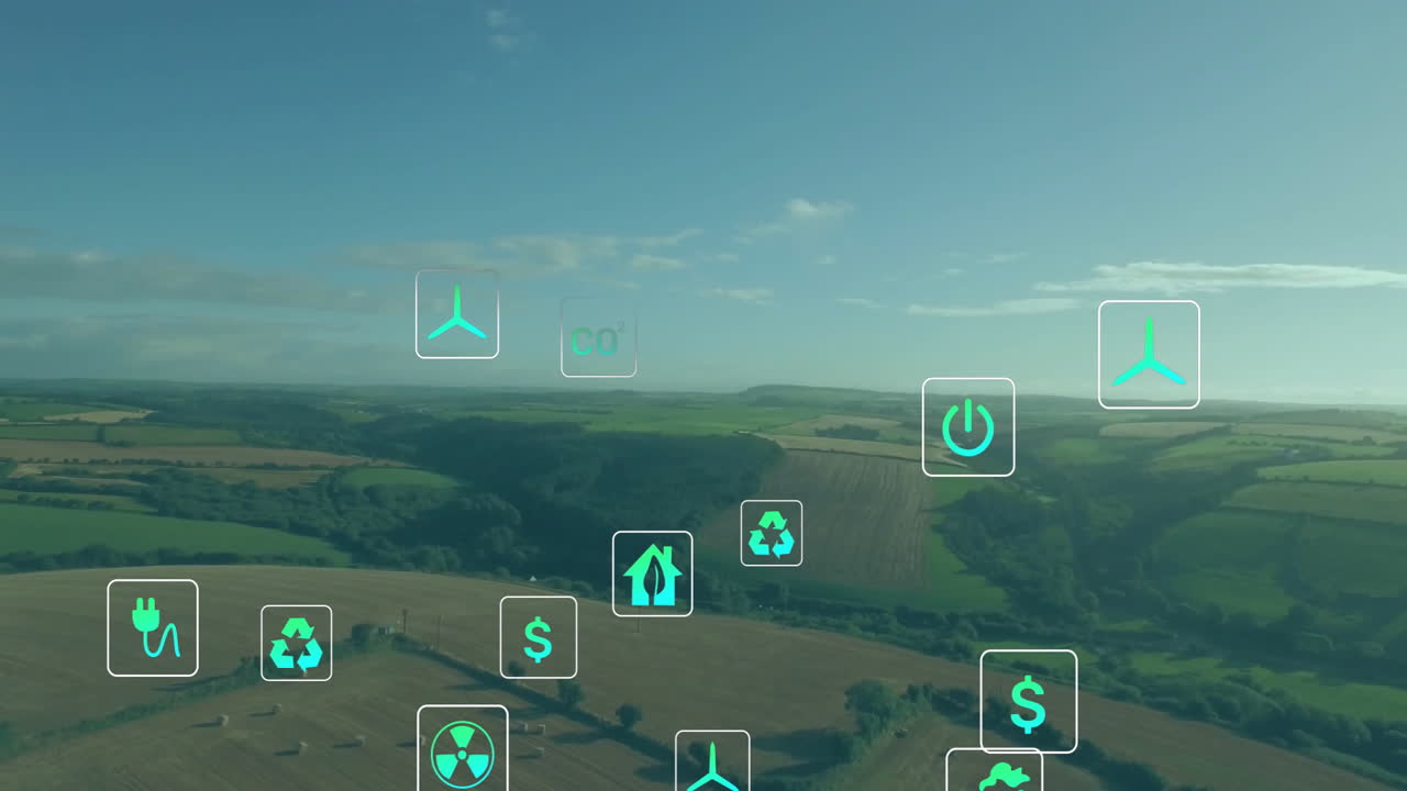 Green energy and sustainability icons animation over aerial view of rural landscape
