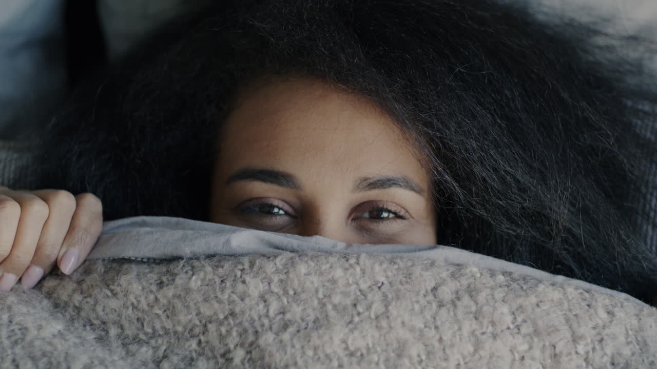 Woman Hiding Under Blanket