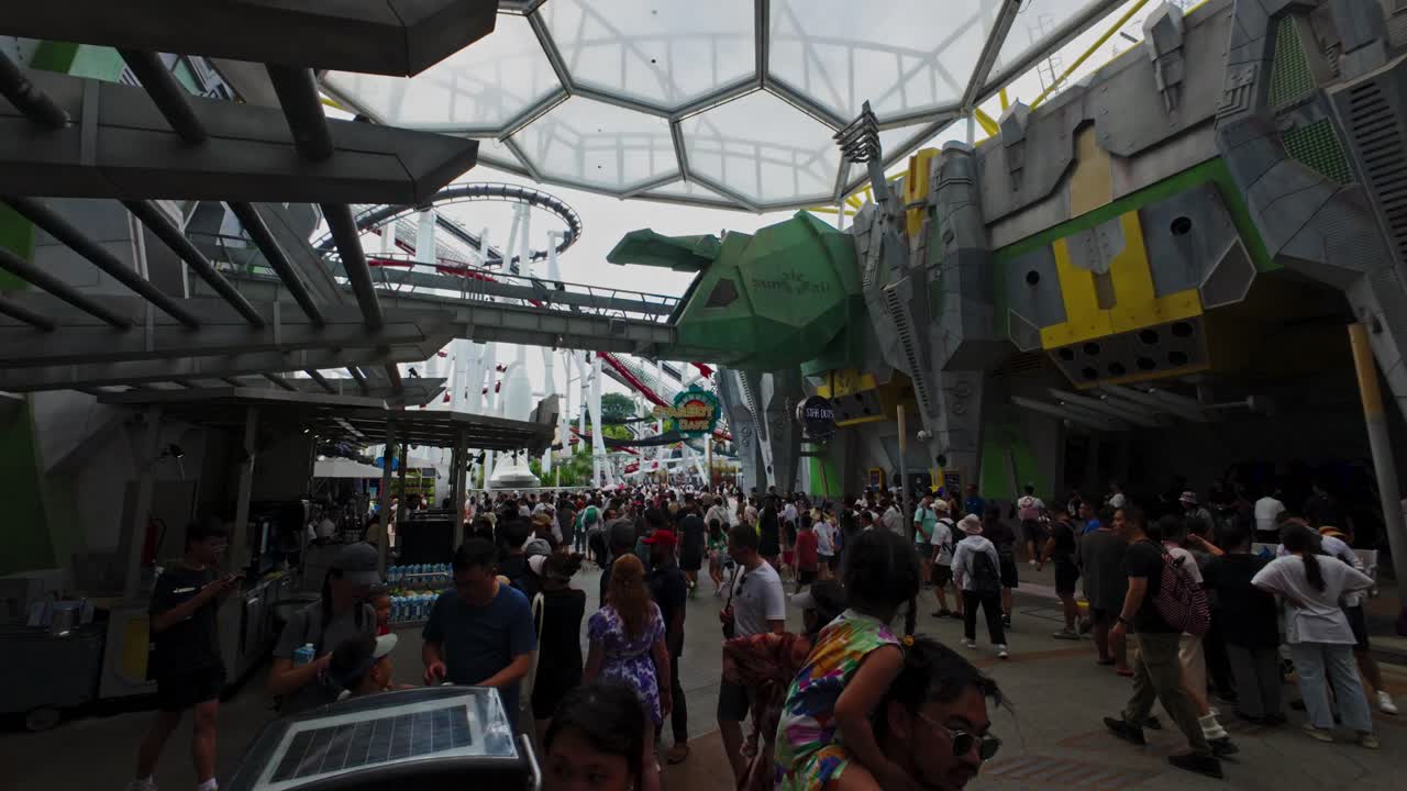 Visitors flock to the entrance of the Transformers ride at Universal Studios Sci-Fi City