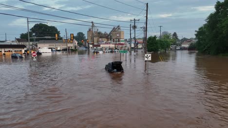 Flood footage in Pennsylvania shows submerged streets and vehicles, highlighting impact of severe weather.Emergency services respond as communities assess damage and begin recovery efforts.Aerial view