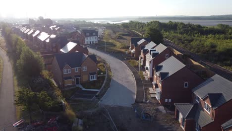 aerial view morning sunrise over british suburban townhouse development building site