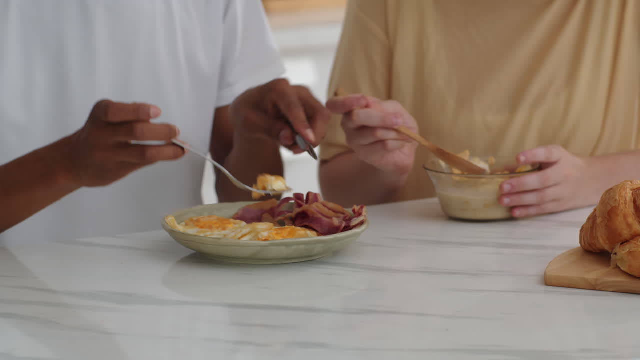 Boyfriend Feeding His Girlfriend with Breakfast