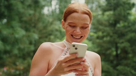 woman using mobile phone outdoors