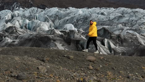 Svinafellsjokull-Glacier,-Iceland---A-Man-Traversing-a-Glacier---Tracking-Shot