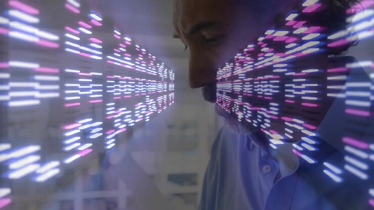 Mature man typing on laptop launching digital code stream while analyzing data in technology office