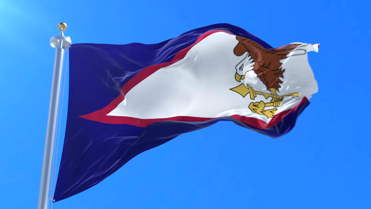 la bandera de samoa americana agitando el viento lentamente con el cielo azul, bucle