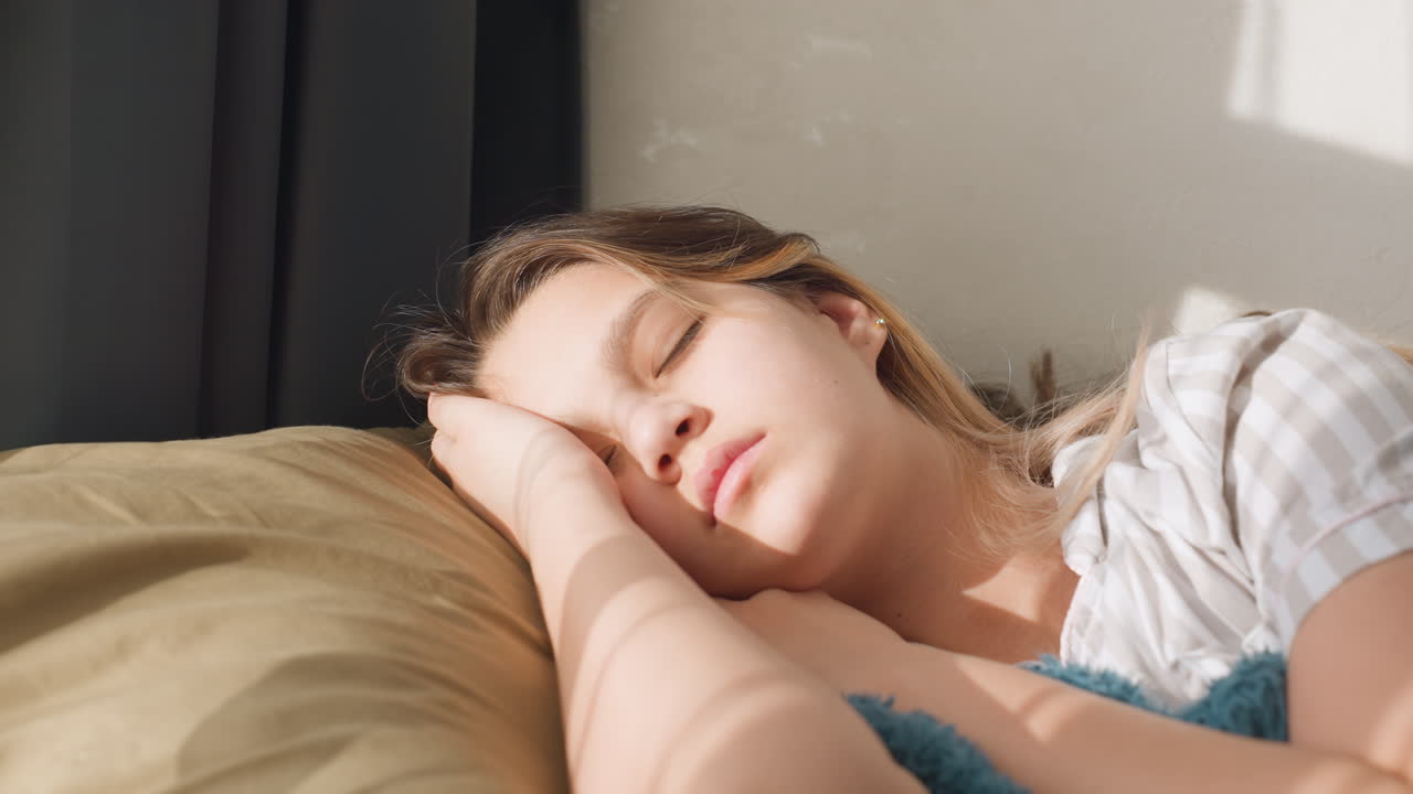 Artist In Tranquil State Resting Peacefully Beneath Sunlit Window With Teal Blanket, Calm Painter Takes Restful Pause Sitting Serenely Beside Sunlit Window Draped With Teal Blanket