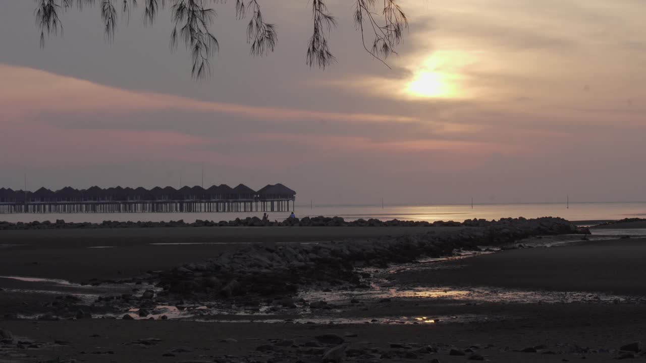 View of Bagan Lalang beach at sunset time. The calmness of sea.