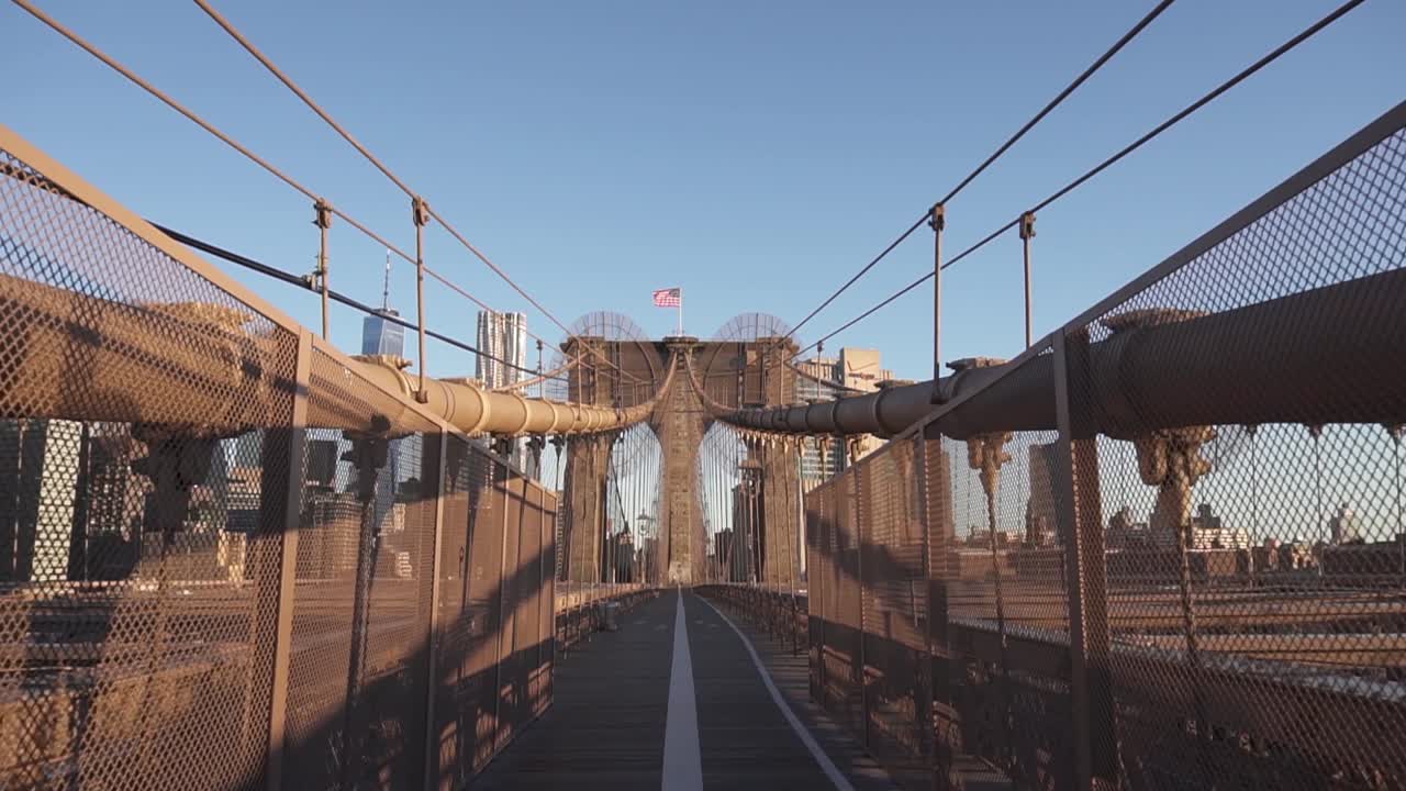 Sunrise at the Brooklyn Bridge in New York City. Morning summer walks.