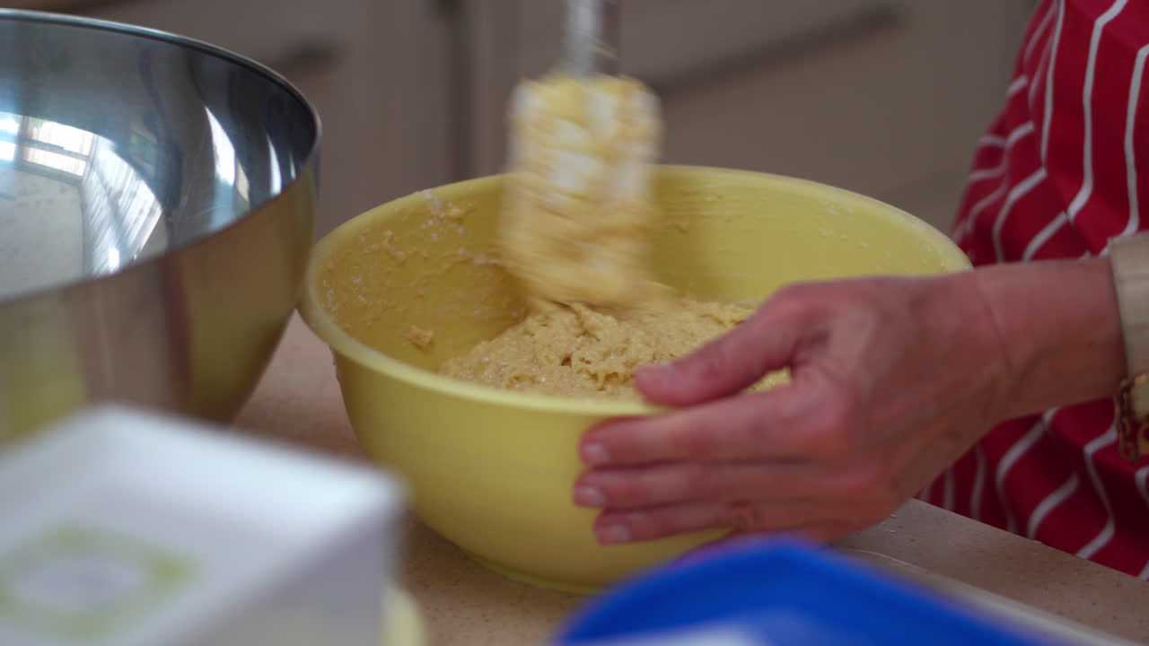 Hand Mixing Halusky In A Bowl. Bryndzove Halusky Recipe. close up