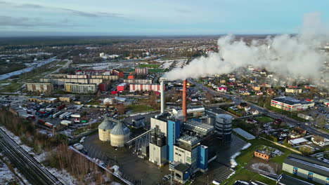 industrial factory in small township, aerial drone view